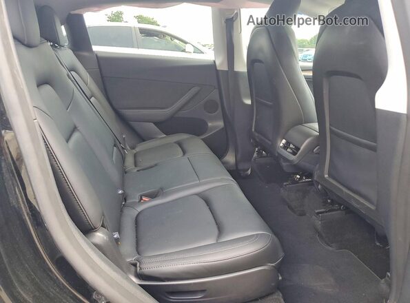 7SAYGAEE5SF296875 2025 TESLA MODEL Black Widok tylnych siedzeń