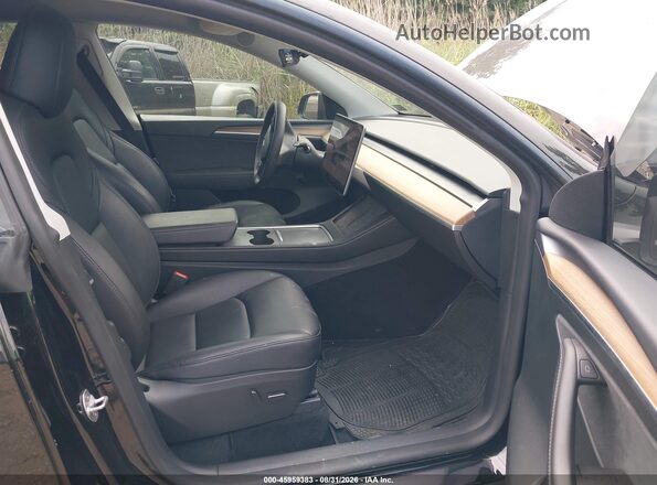 7SAYGAEE7RF982040 2024 TESLA MODEL Y Black Front interior view