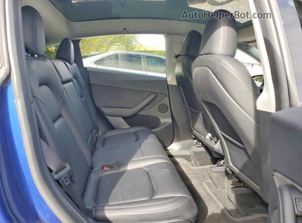 7SAYGAEEXRF982226 2024 TESLA MODEL Blue Rear interior view