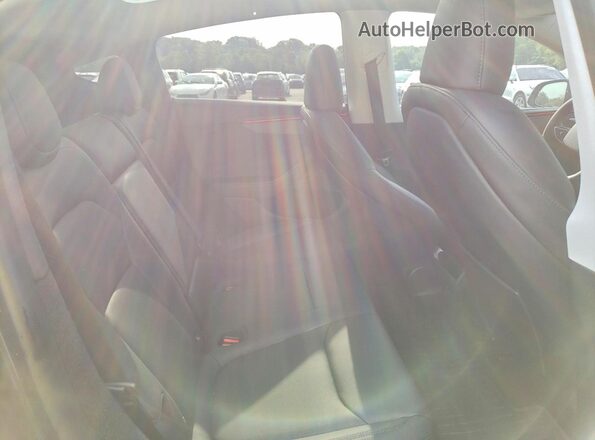 7SAYGDED3TF434990 2026 TESLA MODEL Charcoal Vista de los asientos traseros