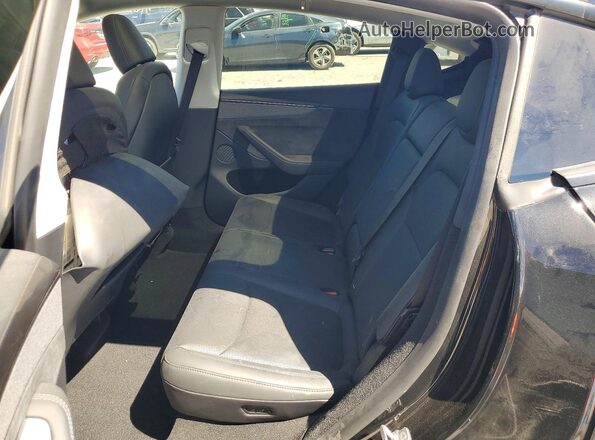 7SAYGDED3TF530246 2026 TESLA MODEL Черный Вид задней части салона