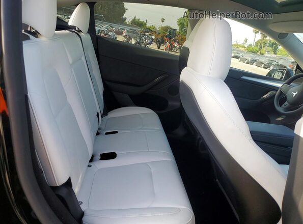 7SAYGDED4RF109760 2024 TESLA MODEL Black Vista de los asientos traseros