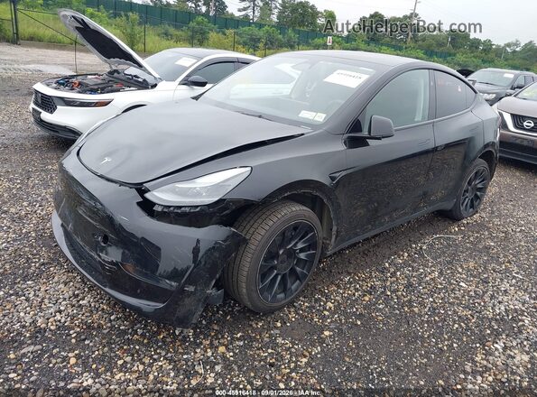 7SAYGDEE0PA183390 2023 TESLA MODEL Y Black წინა მარცხენა ხედი სამი მეოთხედიდან