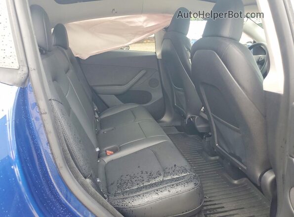 7SAYGDEE5RA317524 2024 TESLA MODEL Blue Vista de los asientos traseros