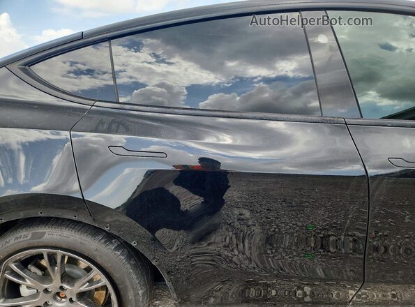 7SAYGDEE5SA337858 2025 TESLA MODEL Black უკანა სალონის ხედი