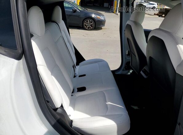 7SAYGDEE8PF909564 2023 TESLA MODEL White Rear interior view
