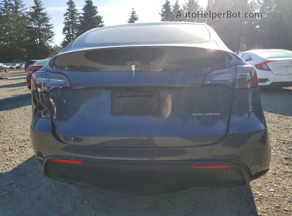 7SAYGDEEXPF609332 2023 TESLA MODEL Gray Rear view
