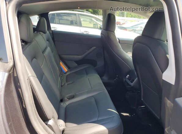 7SAYGDEEXRA275691 2024 TESLA MODEL Black Vista de los asientos traseros