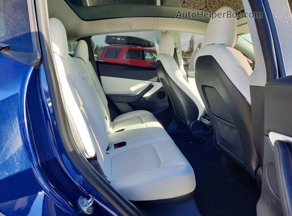7SAYGDEF2NF381557 2022 TESLA MODEL Blue Rear interior view