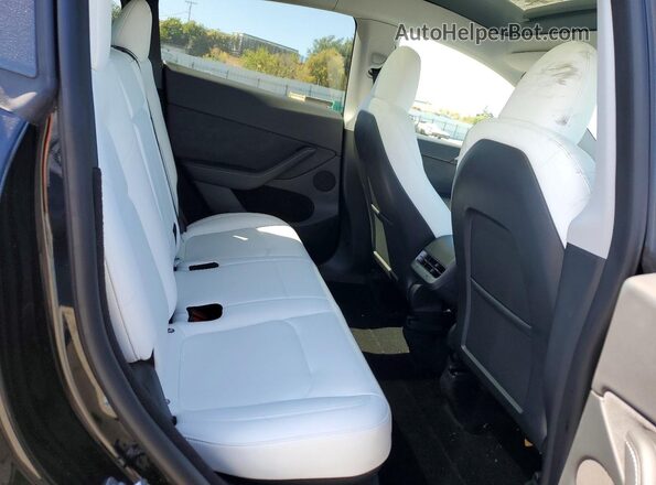 7SAYGDEF5PF741133 2023 TESLA MODEL Black Vista de los asientos traseros