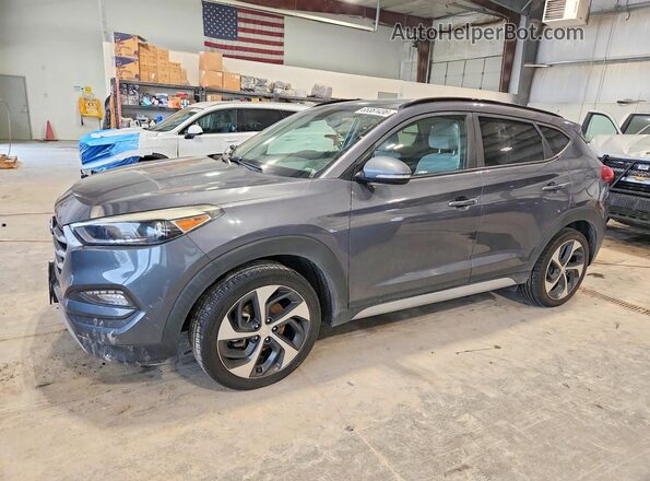 KM8J3CA20JU633259 2018 HYUNDAI TUCSON Gray Trasero izquierdo