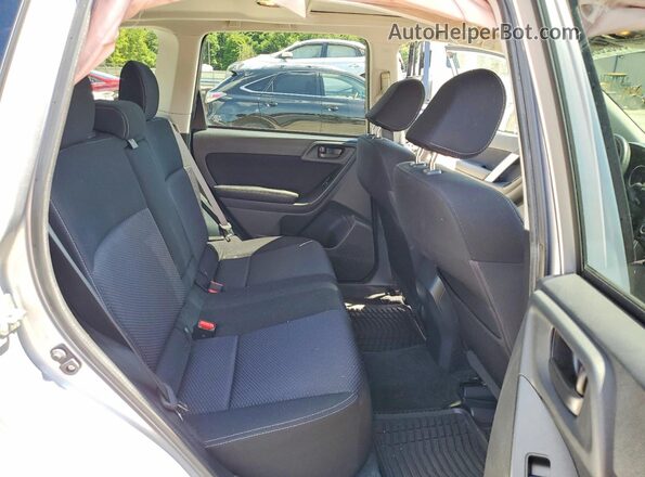 JF2SJADC9GH479824 2016 SUBARU FORESTER Silver Vista interior trasera