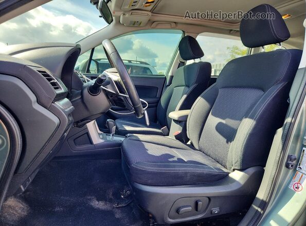 JF2SJCNC7GH564798 2016 SUBARU FORESTER Green Vista interior delantera