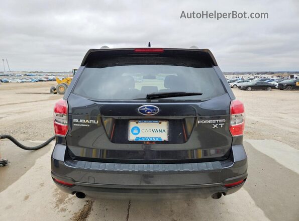 JF2SJGVC6GH407299 2016 SUBARU FORESTER Gray Rear view