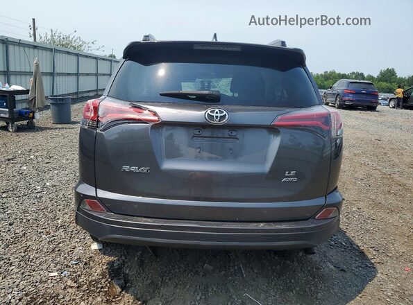 JTMBFREV9JJ744319 2018 TOYOTA RAV4 Black Vista trasera