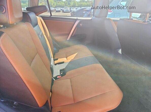 JTMDJREV4JD168032 2018 TOYOTA RAV4 Blue Vista interior trasera
