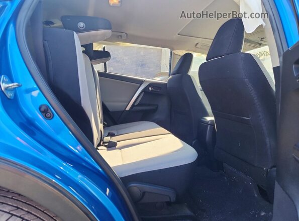 JTMWFREV6JJ724367 2018 TOYOTA RAV4 Синий Вид задней части салона