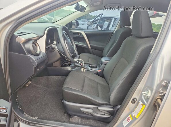 JTMZFREV3JJ187101 2018 TOYOTA RAV4 Silver Front interior view