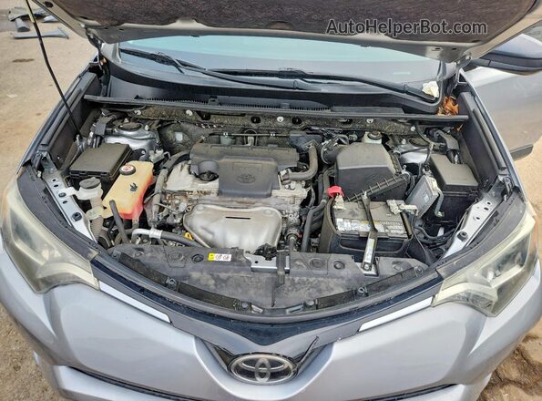 JTMZFREV3JJ187101 2018 TOYOTA RAV4 Silver Rear interior view
