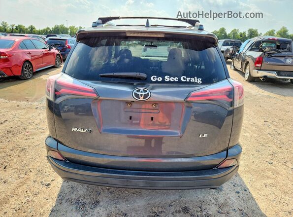 JTMZFREV8GD084067 2016 TOYOTA RAV4 Charcoal Vista trasera