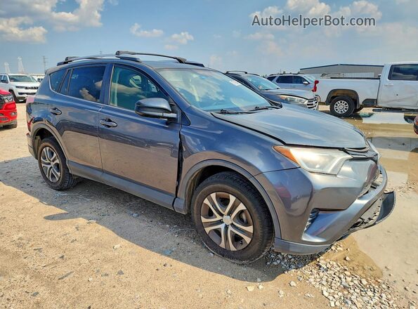 JTMZFREV8GD084067 2016 TOYOTA RAV4 Charcoal Delantero derecho