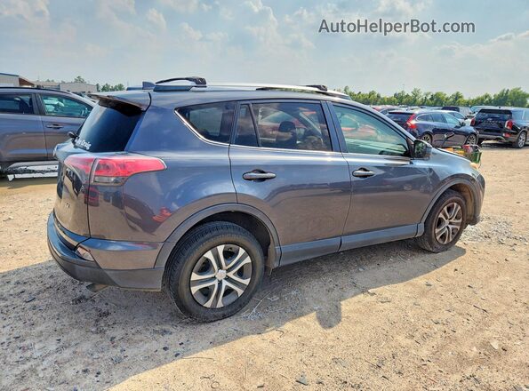 JTMZFREV8GD084067 2016 TOYOTA RAV4 Charcoal Trasero derecho