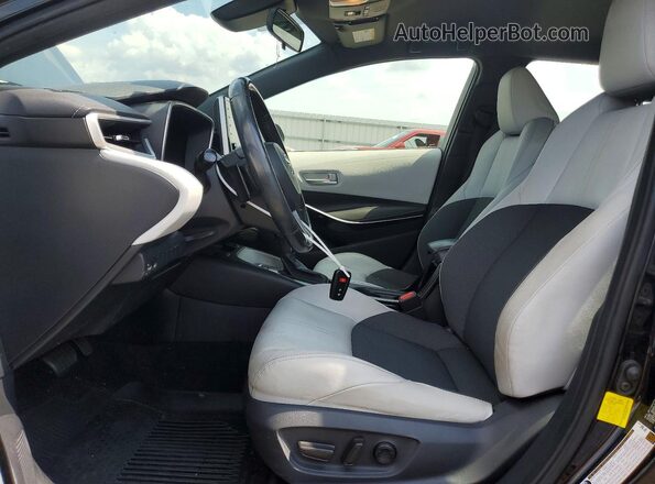 JTNK4RBE6K3024701 2019 TOYOTA COROLLA Black Front interior view