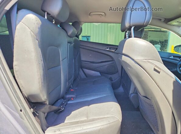 KM8J33A23GU231809 2016 HYUNDAI TUCSON Gray Vista interior trasera