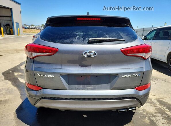 KM8J33A23GU231809 2016 HYUNDAI TUCSON Gray Vista trasera