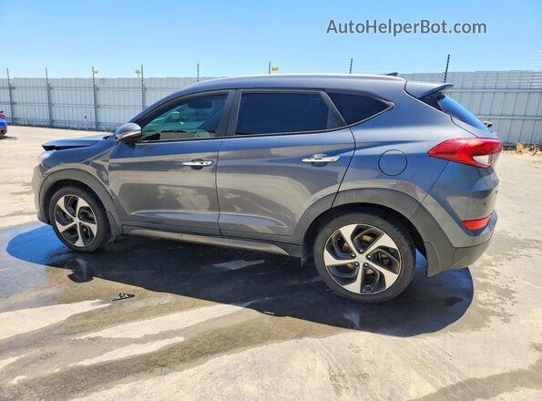 KM8J33A23GU231809 2016 HYUNDAI TUCSON Gray Trasero izquierdo
