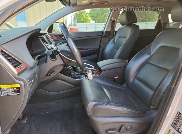 KM8J3CA24GU095075 2016 HYUNDAI TUCSON Silver Vista interior delantera