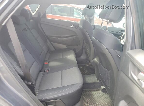 KM8J3CA25GU049142 2016 HYUNDAI TUCSON Gray Rear interior view