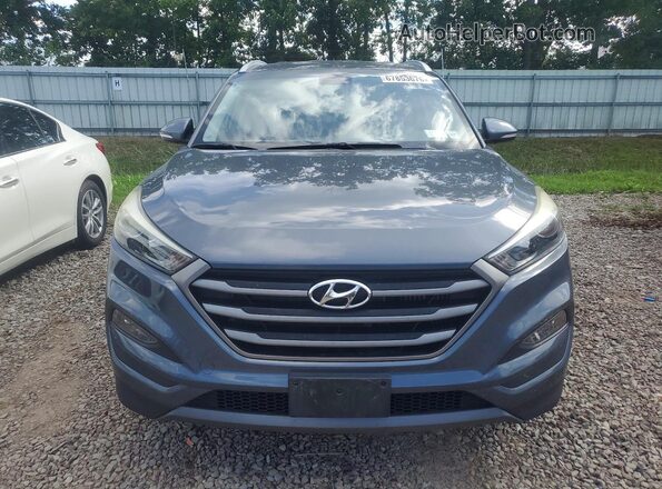 KM8J3CA25GU049142 2016 HYUNDAI TUCSON Gray Front view