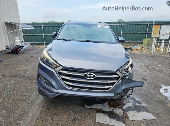 KM8J3CA44GU210467 2016 HYUNDAI TUCSON Gray Front view