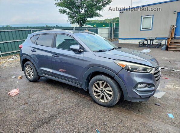 KM8J3CA44GU210467 2016 HYUNDAI TUCSON Gray Front right