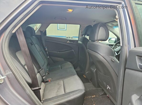 KM8J3CA44GU210467 2016 HYUNDAI TUCSON Gray Rear interior view