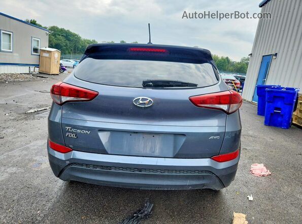 KM8J3CA44GU210467 2016 HYUNDAI TUCSON Gray Rear view