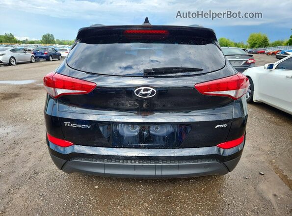 KM8J3CA46JU773365 2018 HYUNDAI TUCSON Black Rear view
