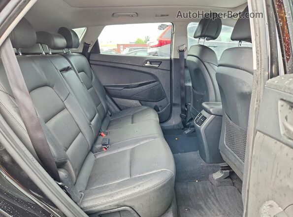 KM8J3CA46JU773365 2018 HYUNDAI TUCSON Black Rear interior view