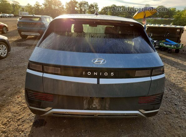 KM8KM4AE2NU070657 2022 HYUNDAI IONIQ Синий Вид сзади