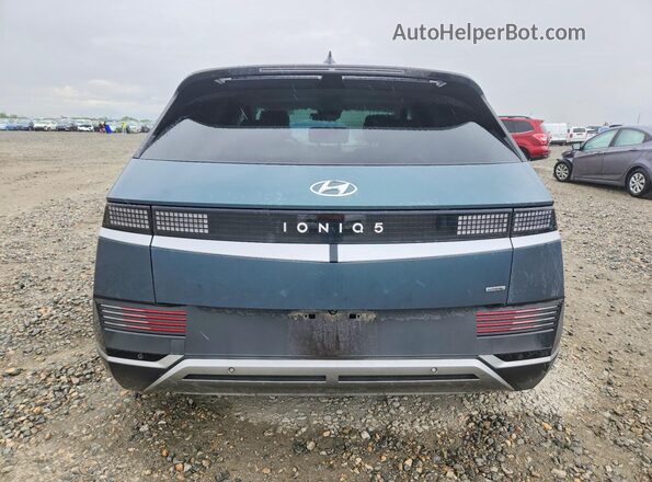 KM8KNDAF1PU201411 2023 HYUNDAI IONIQ Бирюзовый Вид сзади