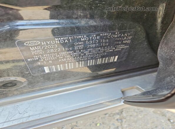 KMHM34AAXPA034003 2023 HYUNDAI IONIQ Black Widok komory silnika