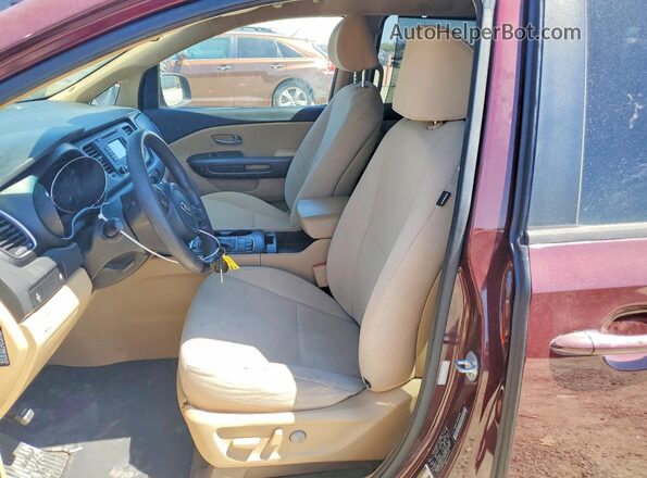 KNDMB5C16G6089688 2016 KIA SEDONA Maroon Вид салону спереду
