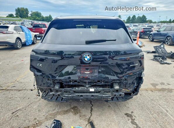 WB523CF06PCM65749 2023 BMW IX Черный Вид сзади