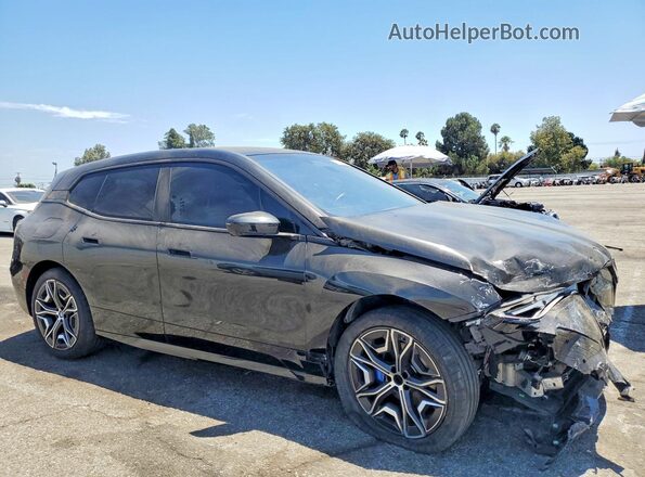 WB523CF09SCS36233 2025 BMW IX Черный Передняя правая четверть