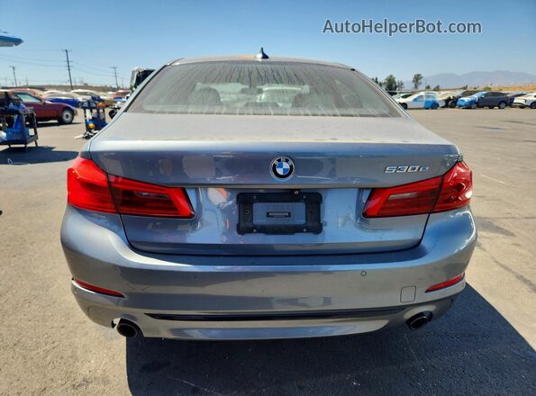 WBAJA9C57JG622906 2018 BMW 5 SERIES Gray Rear view