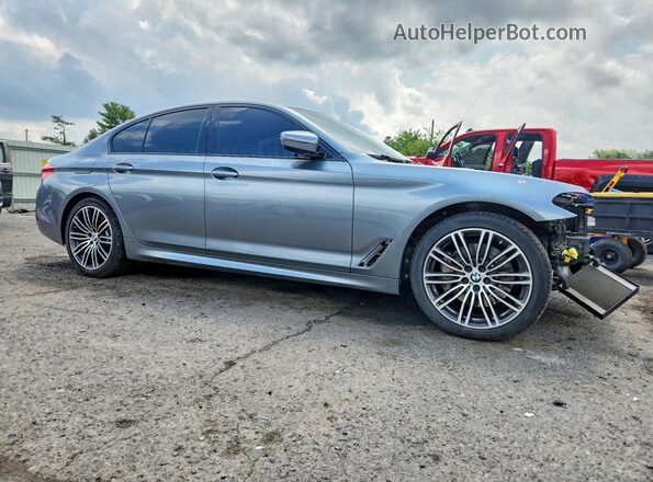 WBAJE7C50KWW25971 2019 BMW 5 SERIES Gray Front right