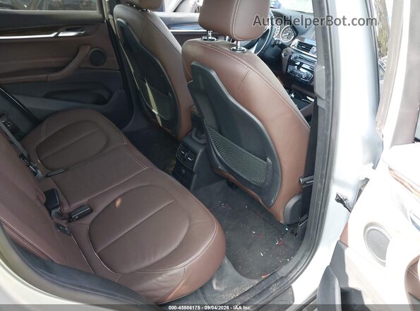 WBXHT3C33G5F65699 2016 BMW X1 Silver VIN sticker view