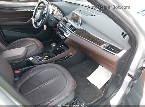 WBXHT3C33G5F65699 2016 BMW X1 Silver Front interior view