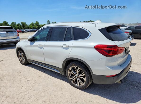 WBXHT3C33G5F67372 2016 BMW X1 White Rear left